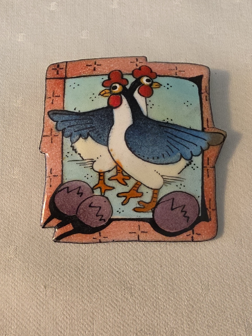 This is a whimsical handcrafted  chicken brooch.